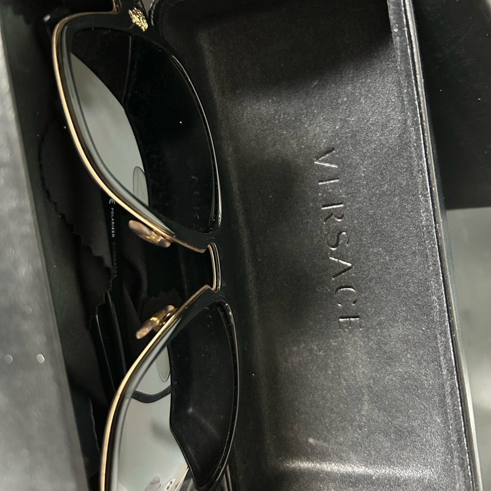 Versace Black Frame Sunglasses with Gold Detailing